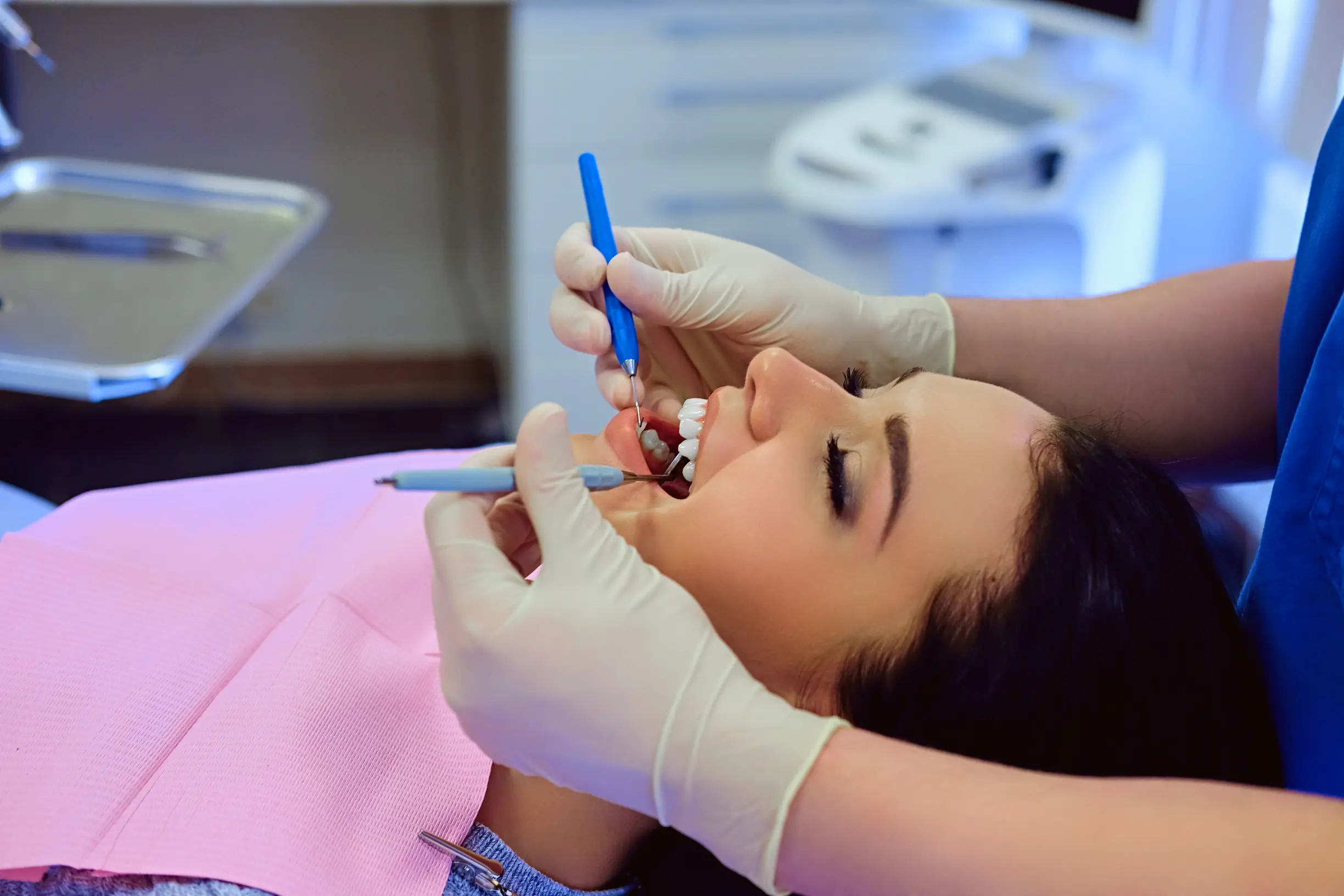 close up image dentist examining female s teeth dentistry